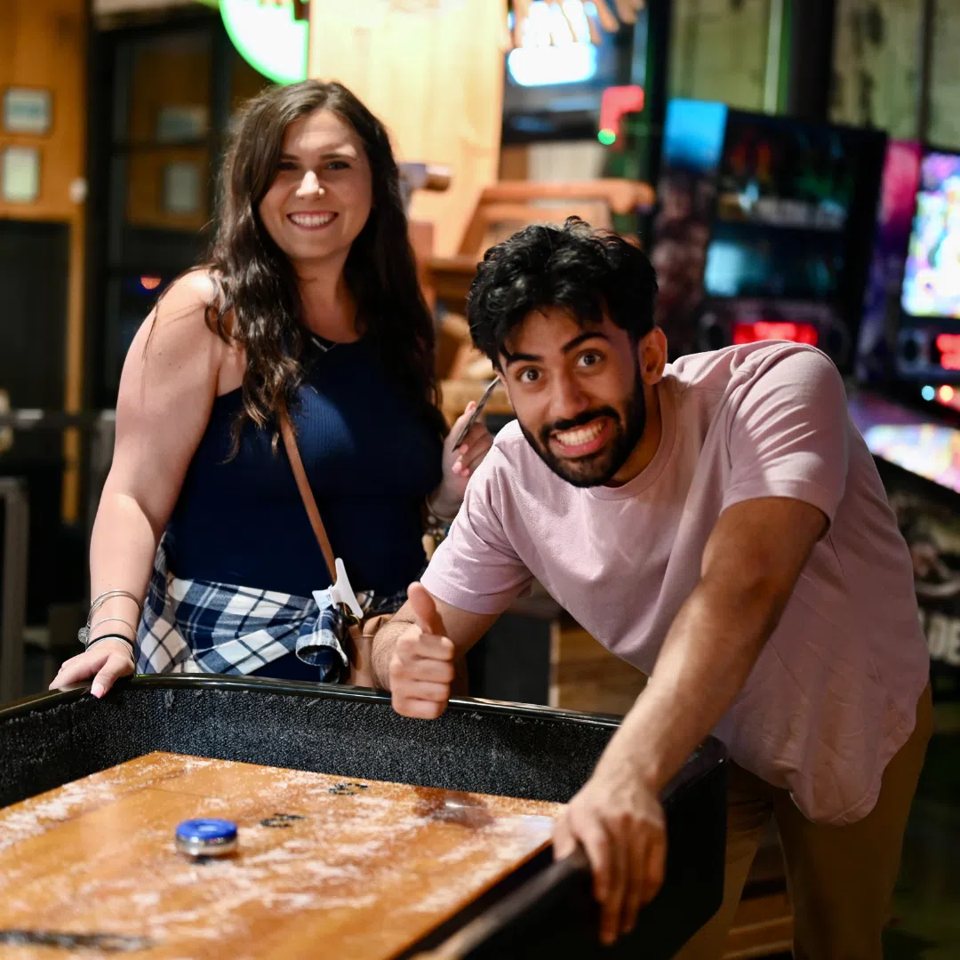 The Yard at Corktown: Group playing shuffleboard inside The Yard