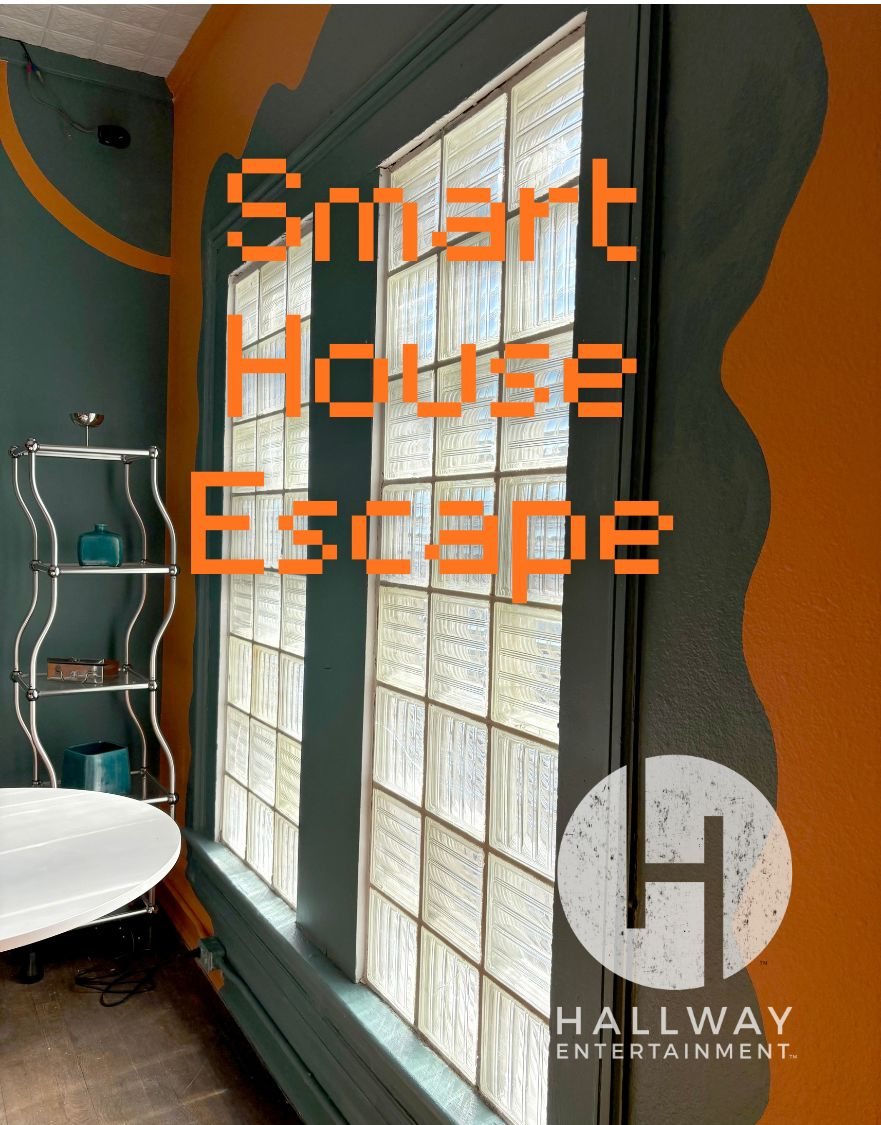 A glass-block window, a metal shelf and a white table between the green and orange walls of the Smart House room