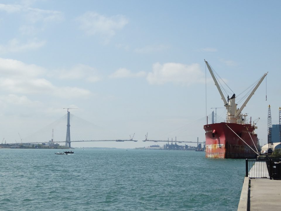 A freighter at Windsor with the bridge under construction, 2024