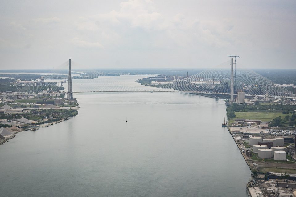 Along the river toward both towers, from the air, 2025