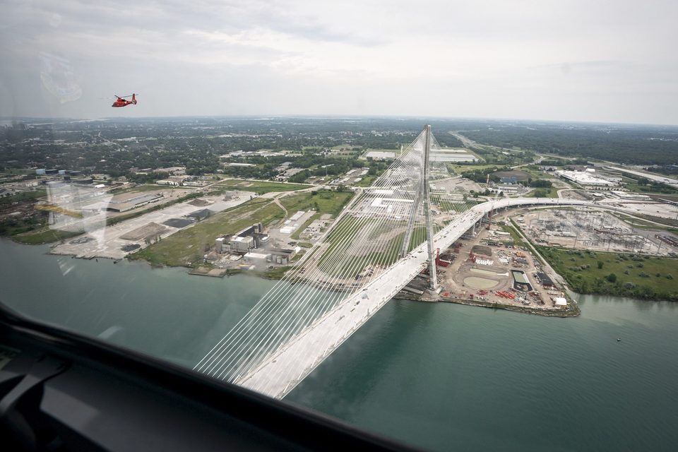 The deck sweeping from a tower to land, seen from a helicopter, 2025