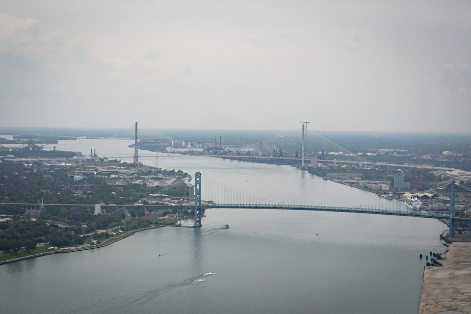 The Ambassador Bridge in front, the Gordie Howe towers downstream, 2025