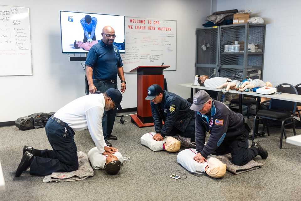 Detroit EMS crews practice chest compressions on manikins
