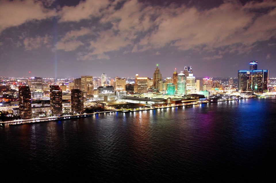 Downtown Detroit at night, the Renaissance Center reflected in the river