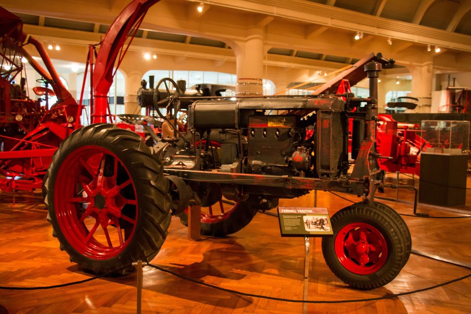 A Farmall tractor and red harvesting machines in the museum’s Agriculture and the Environment section (photo: 2015)