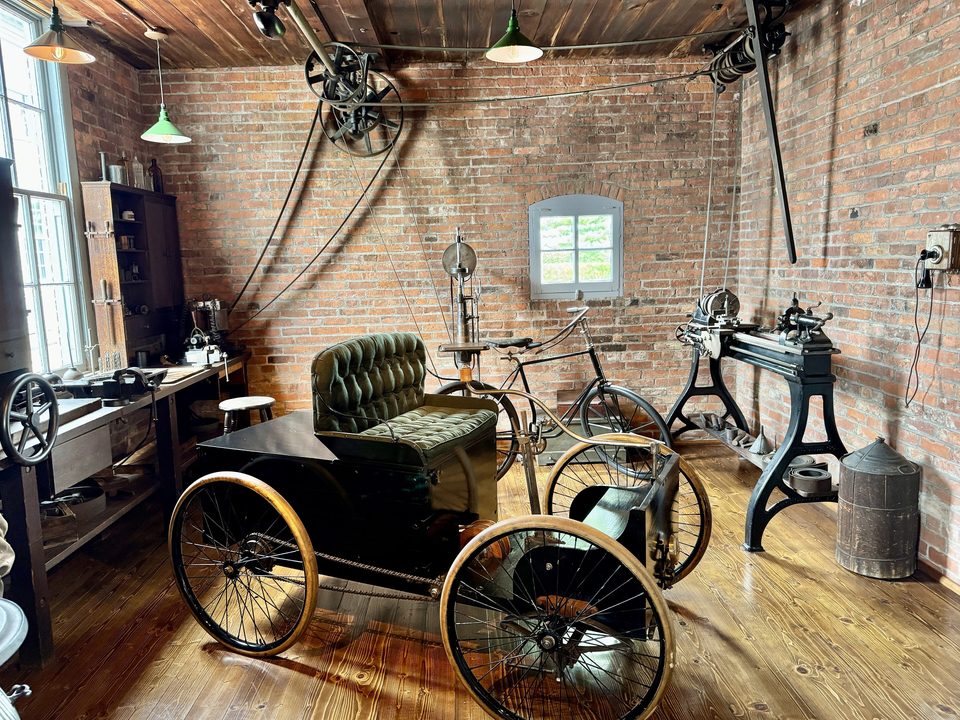 The rebuilt Bagley Avenue shed with a Quadricycle inside; Ford built his first car in the original in 1896 (photo: 2024)