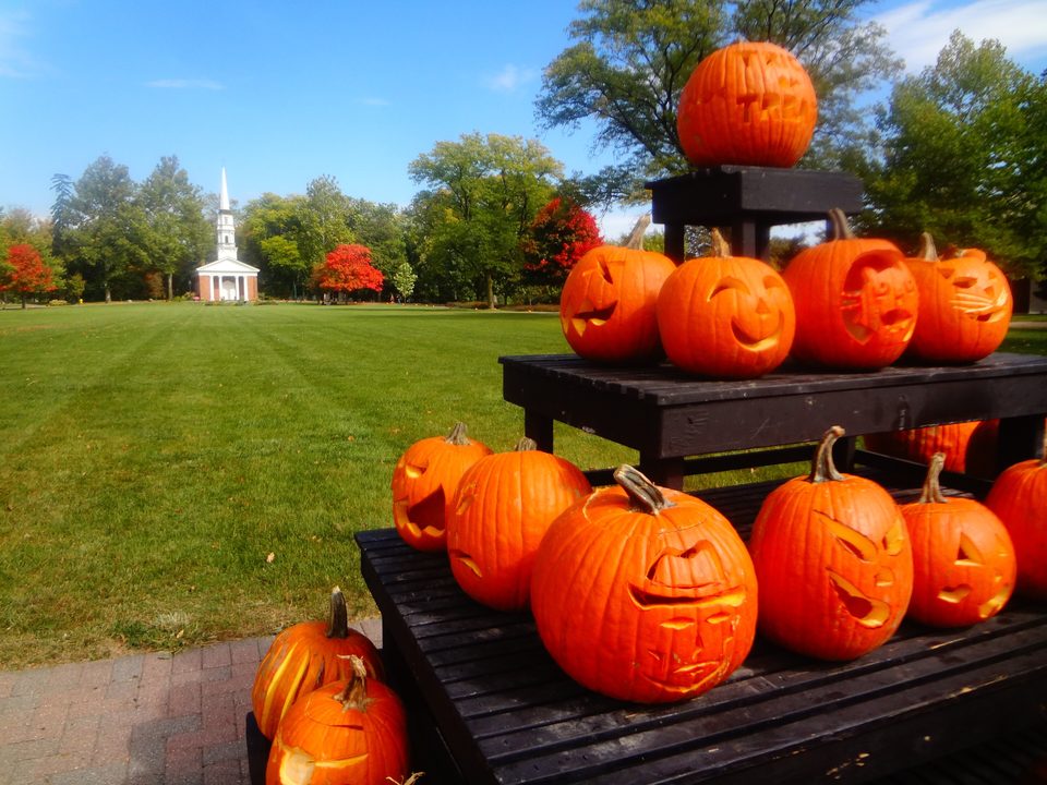 A pyramid of carved pumpkins on the Village Green, with Martha-Mary Chapel behind, October 2012