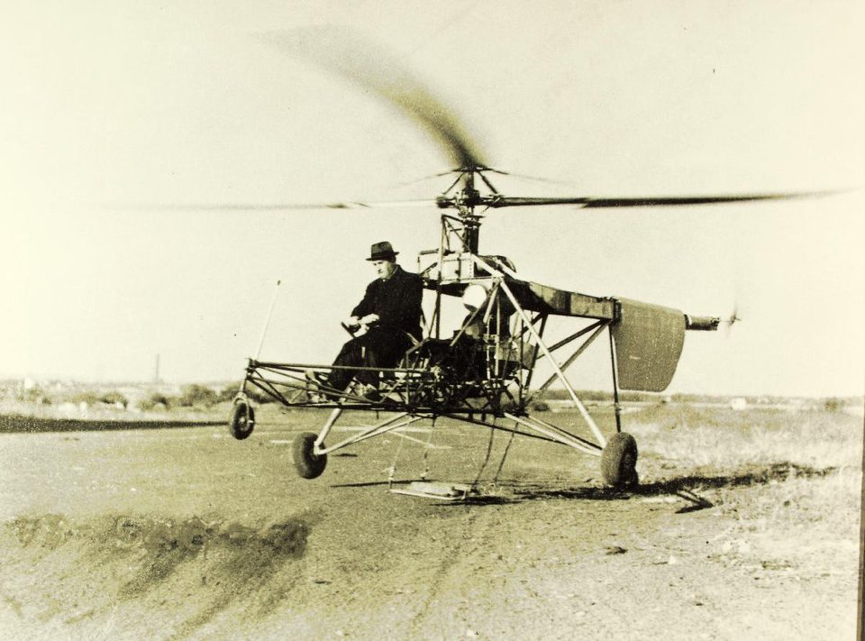 Igor Sikorsky flying the VS-300 helicopter, a period photo; the same aircraft, as the VS-300A, is in the museum, where he flew it in himself in 1943