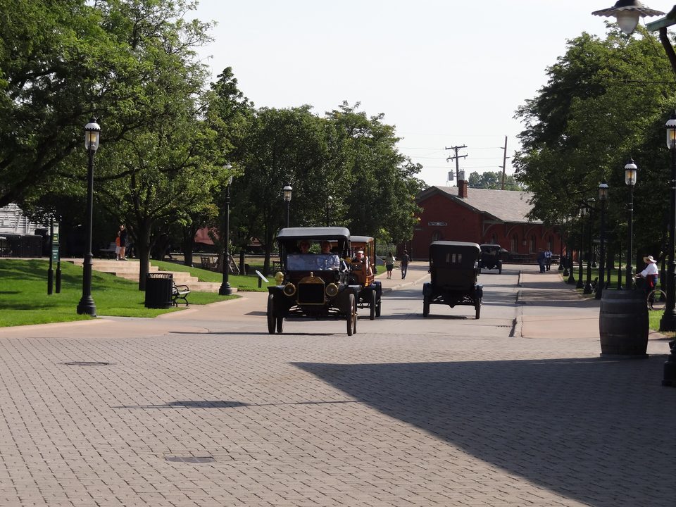 Model Ts rolling down a Greenfield Village street, July 2012