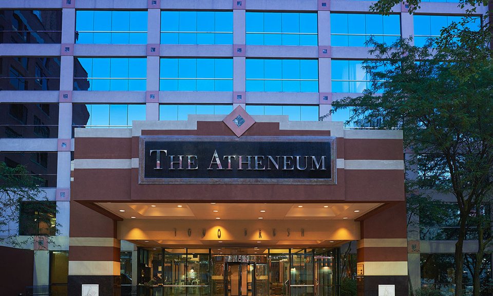 The hotel entrance with The Atheneum sign in Greektown