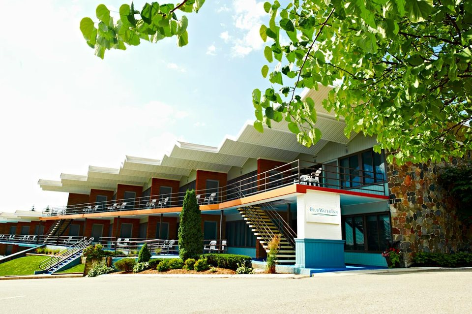 The inn's long building with a zigzag roofline, balconies and the Blue Water Inn sign