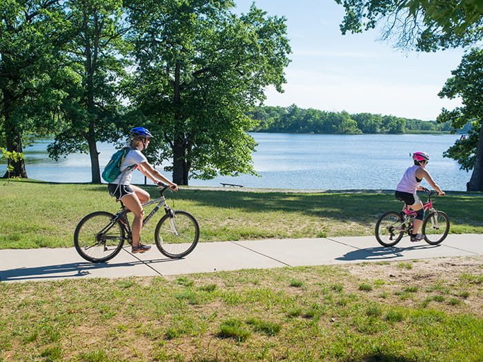 Cyclists on the path along the lake