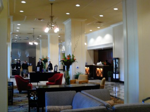 The hotel's restored lobby with chandeliers and seating