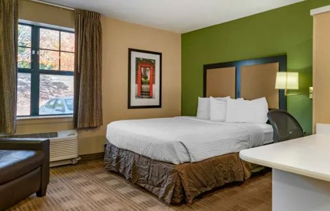 A room with a bed and a desk