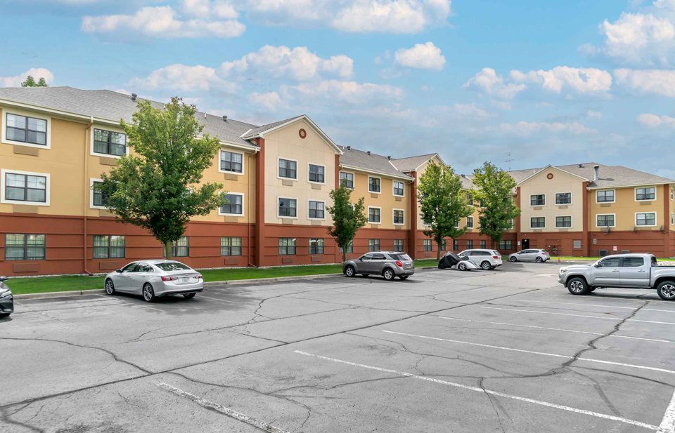 The hotel building with its parking lot