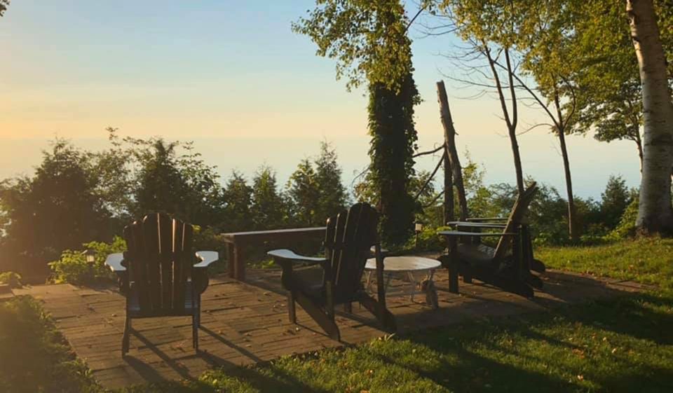 Chairs on the lakeside lawn at sunset