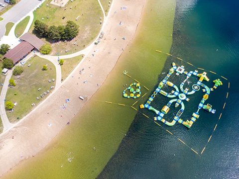 Aerial view of the beach and floating water play area