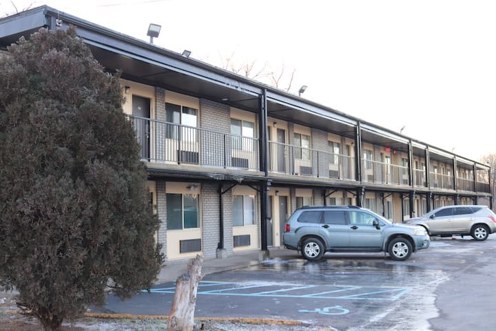 The two-storey motel building and parking lot