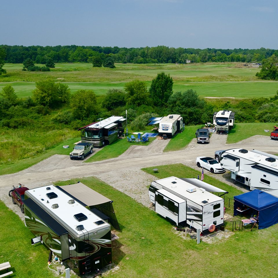 Aerial view of RVs on the grass at the campground