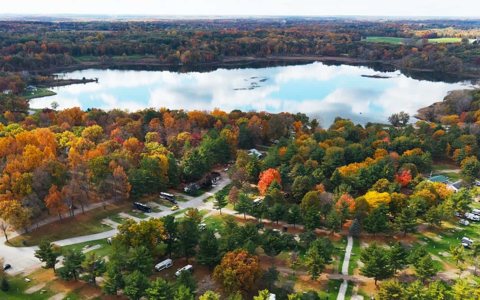 Aerial view of the woods and lake in autumn
