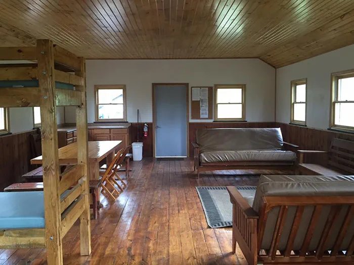 Rustic lodging interior with bunk beds