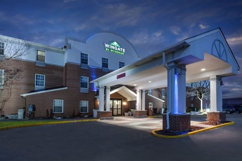 The lit entrance at dusk