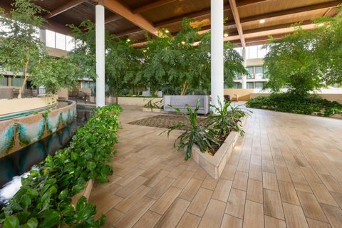 The atrium's indoor garden full of trees and plants
