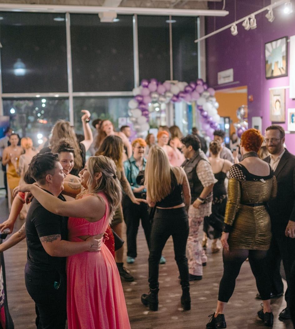 Guests dancing at an evening community celebration
