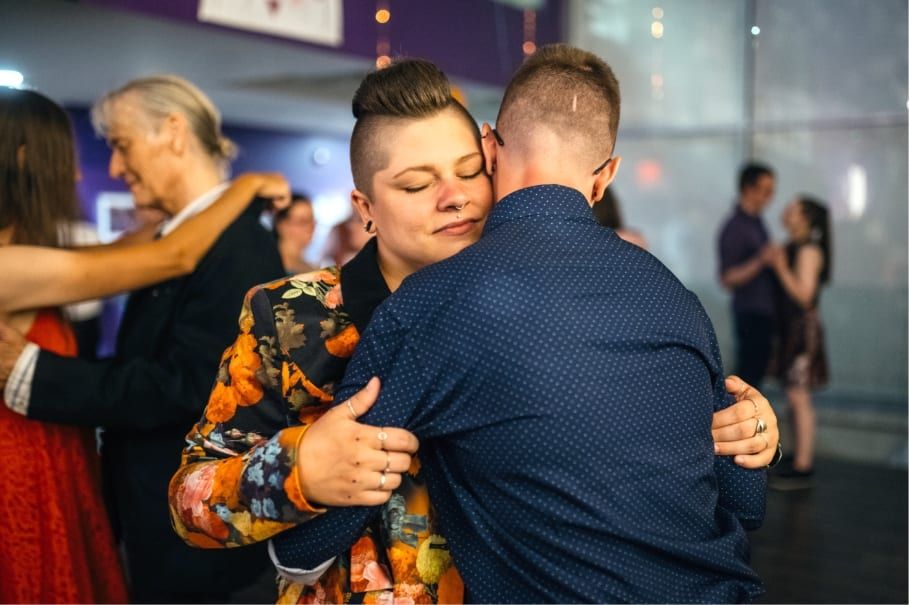 Two people embracing at a community dance night