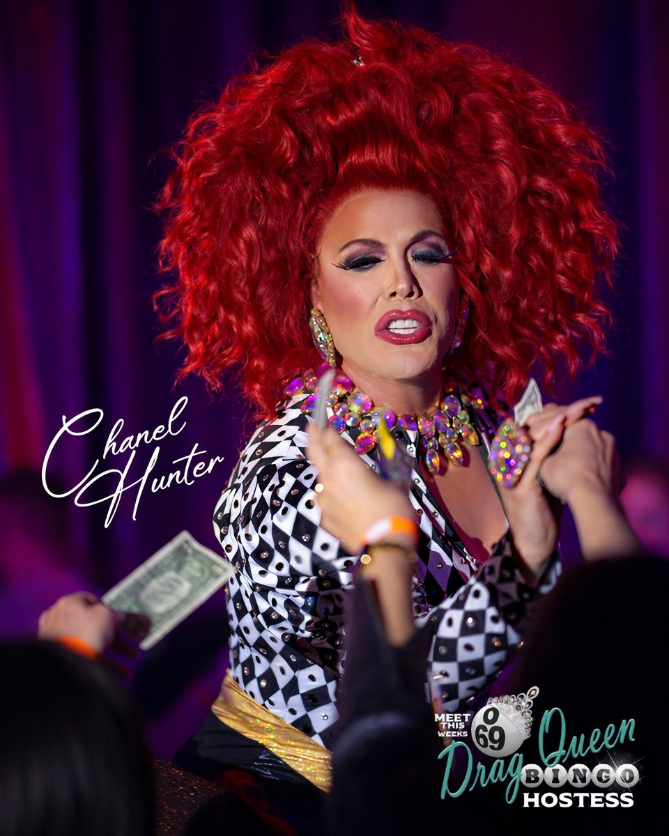 Chanel Hunter, Five15 Drag Queen Bingo hostess, in a voluminous red wig