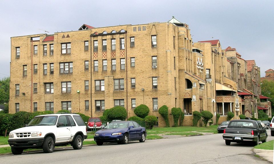 Row of yellow-brick apartment buildings in the Palmer Park historic district
