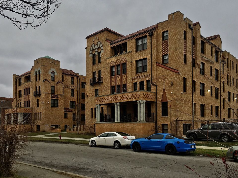 Ornate brick facade of the Coronado Square Apartments in Palmer Park