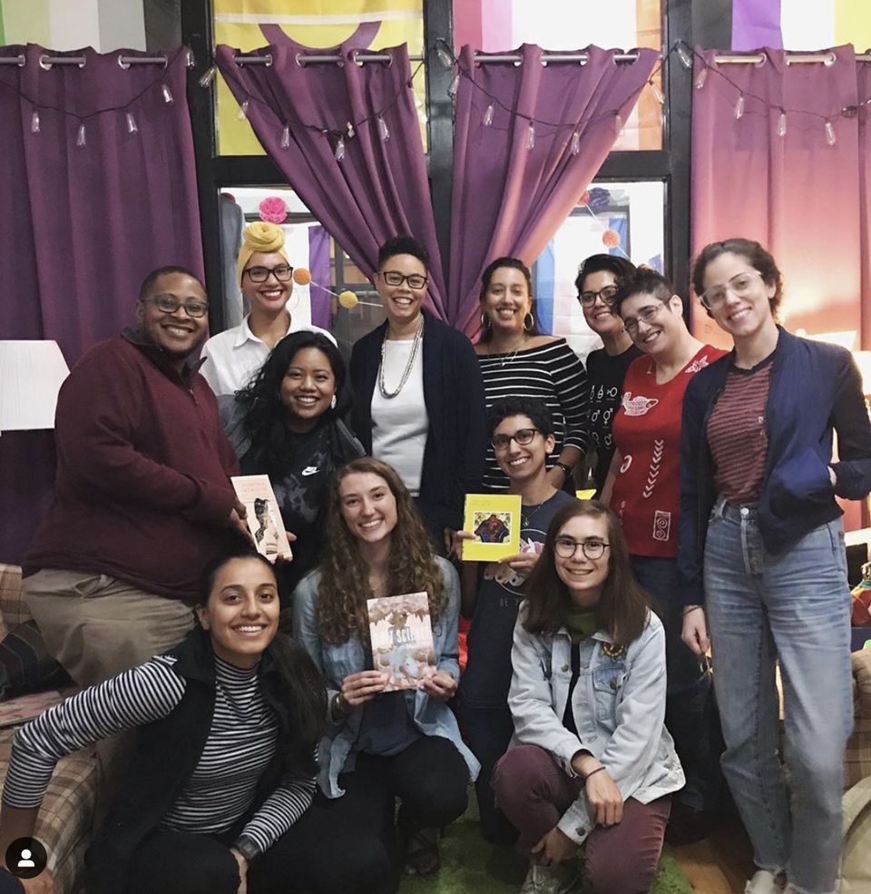 Smiling group photo at a community gathering at Salus Center