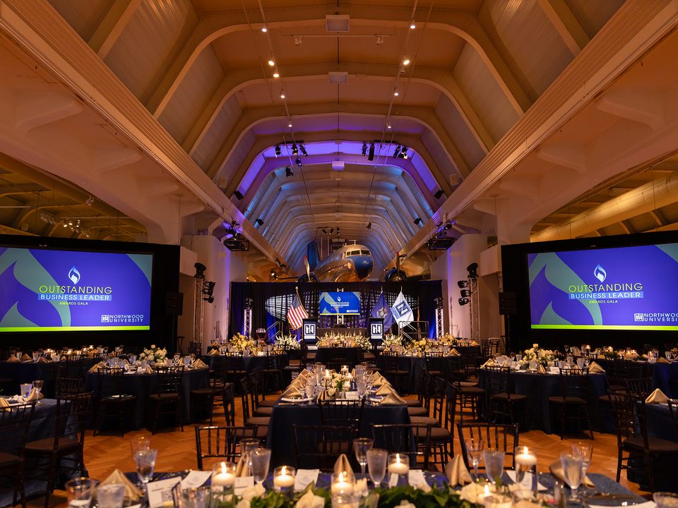 Henry Ford Museum of American Innovation — Museum Plaza set with tables and screens for a private event