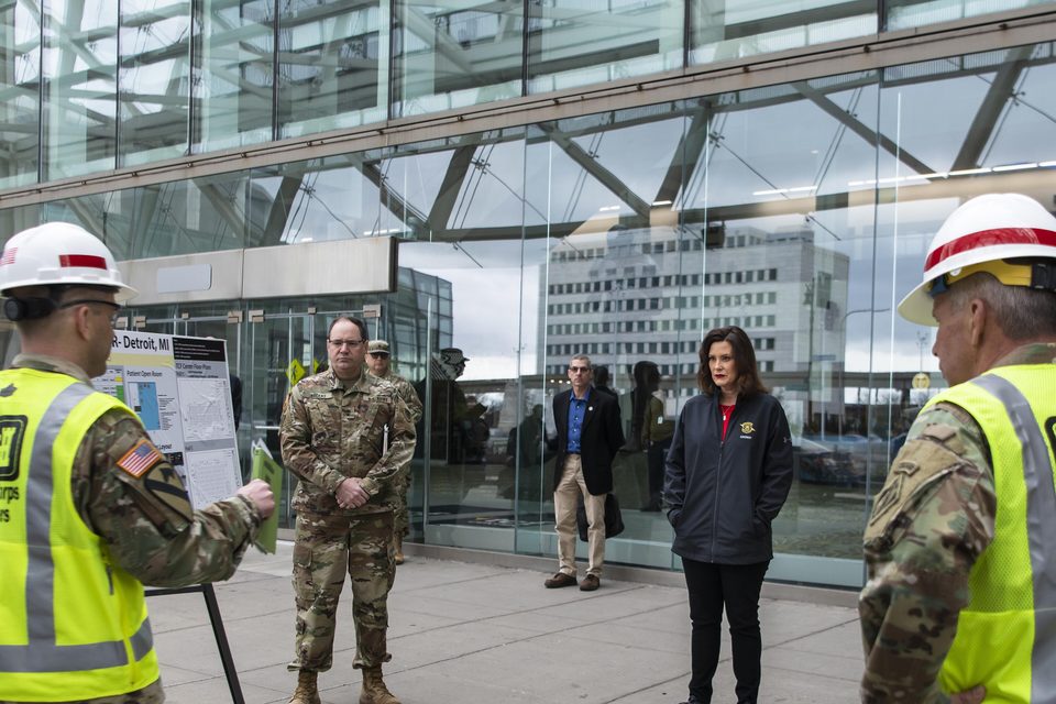 Gretchen Whitmer is briefed on the capabilities and status of converting Detroit's TCF Center into an alternate care site for COVID-19 cases