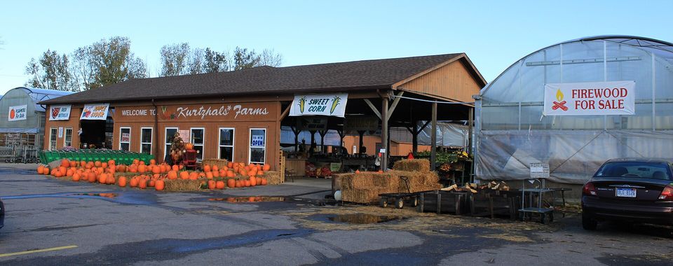 The Kurtzhals Farm stand in fall, piled with pumpkins