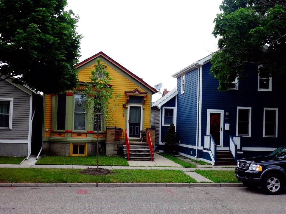 Brightly painted worker cottages on a Corktown street
