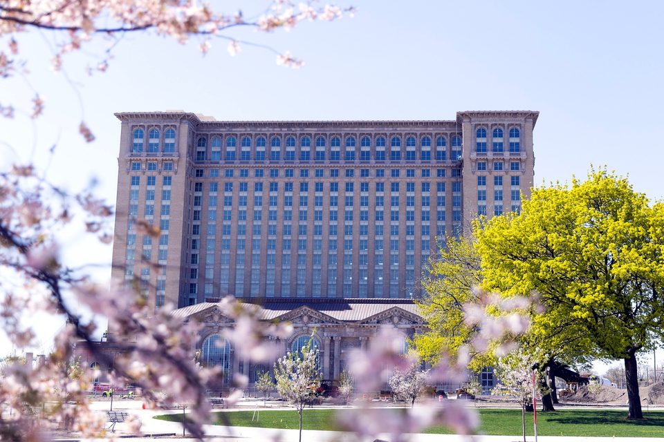 Cherry blossoms framing the cleaned facade, 2023