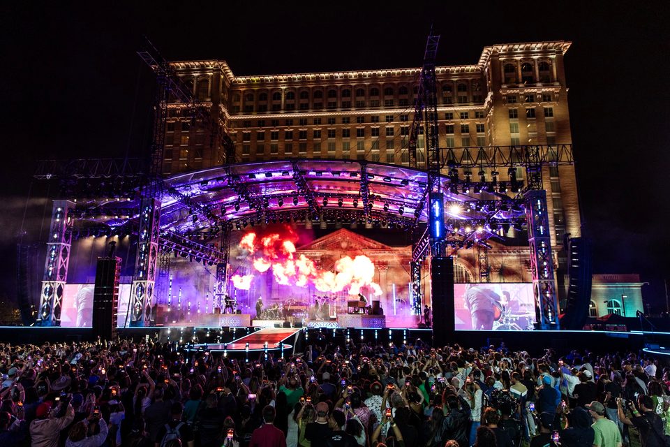The lit-up station behind the reopening concert stage, 2024