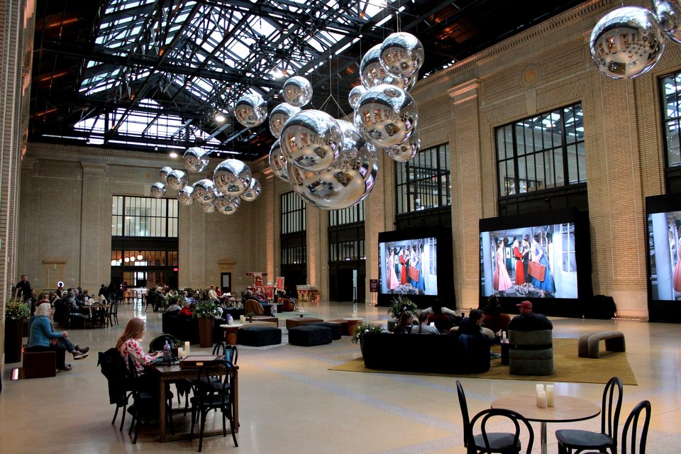 The restored concourse with seating and holiday baubles, 2025