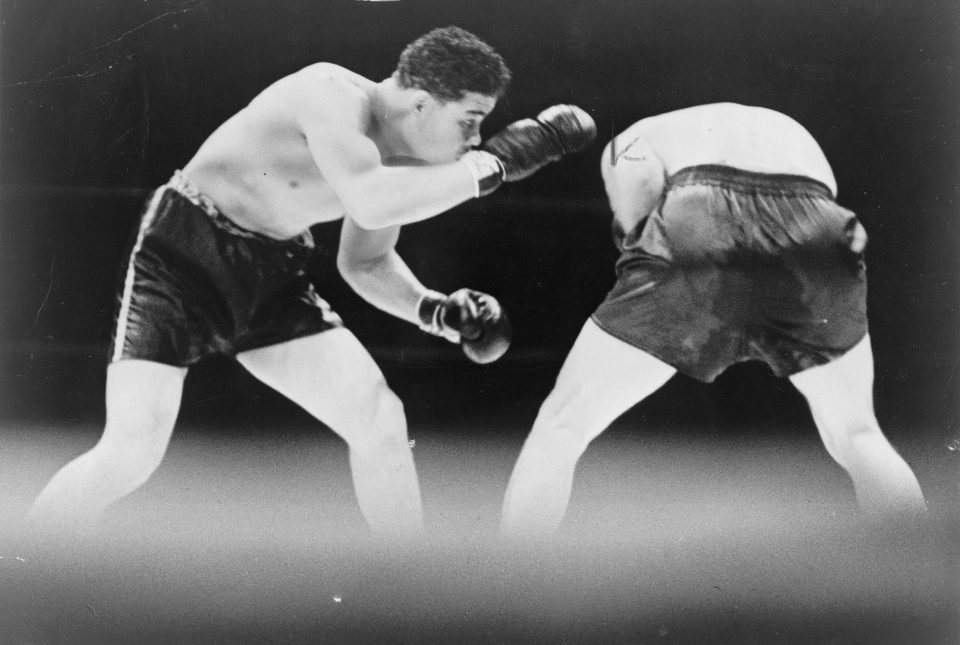 Joe Louis looks for an opening against Max Schmeling in the ring, black-and-white photo