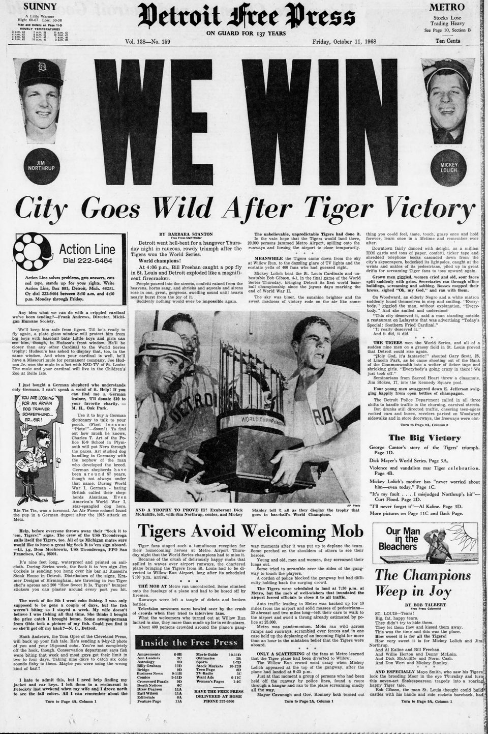 Detroit Free Press front page with a giant WE WIN headline and a photo of celebrating Tigers players
