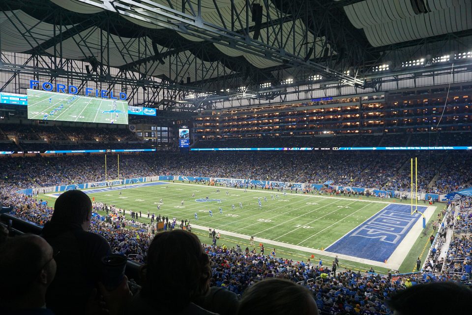 Ford Field from the upper deck during a kickoff, with a full house